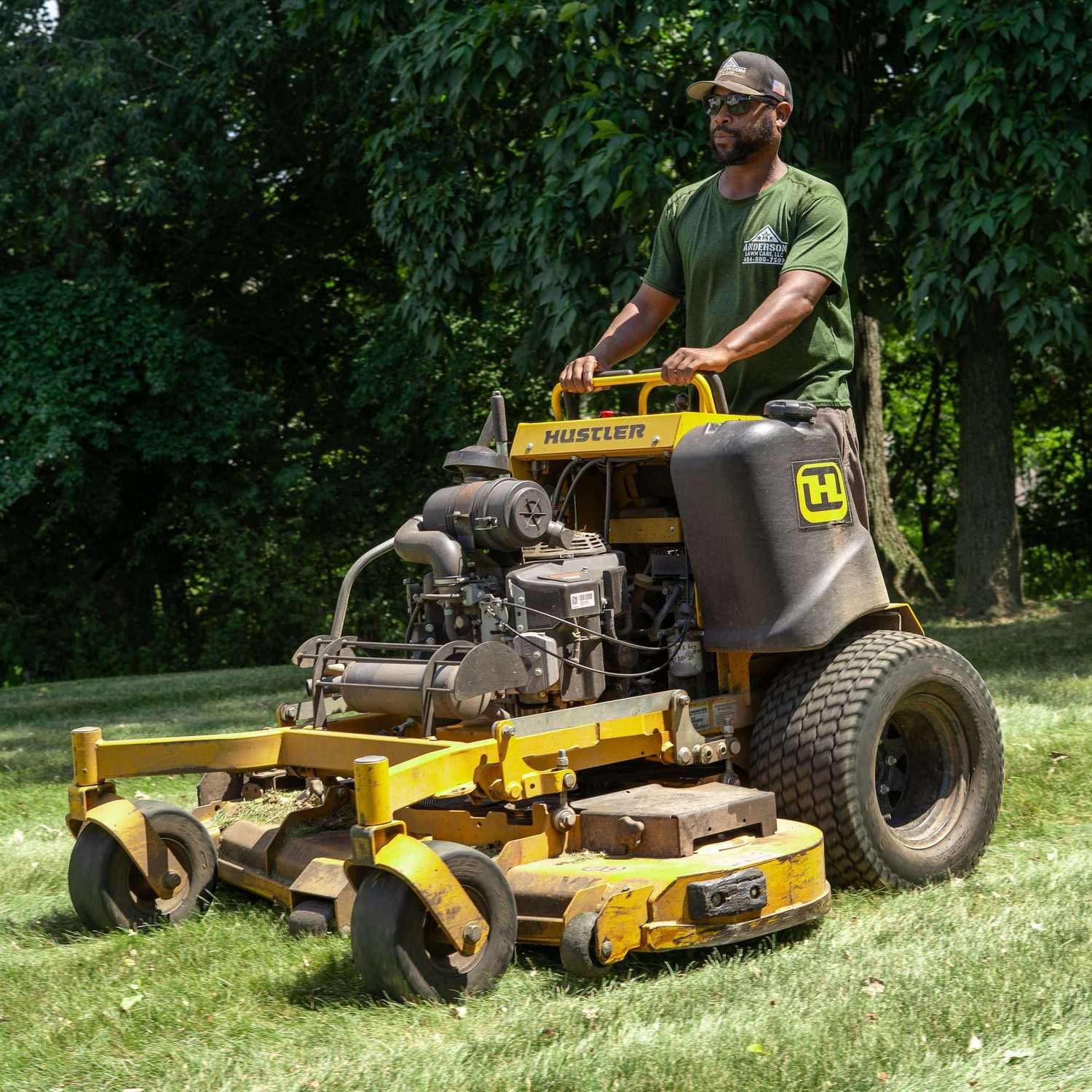 Anderson Lawn Care crew with equipment on a job site